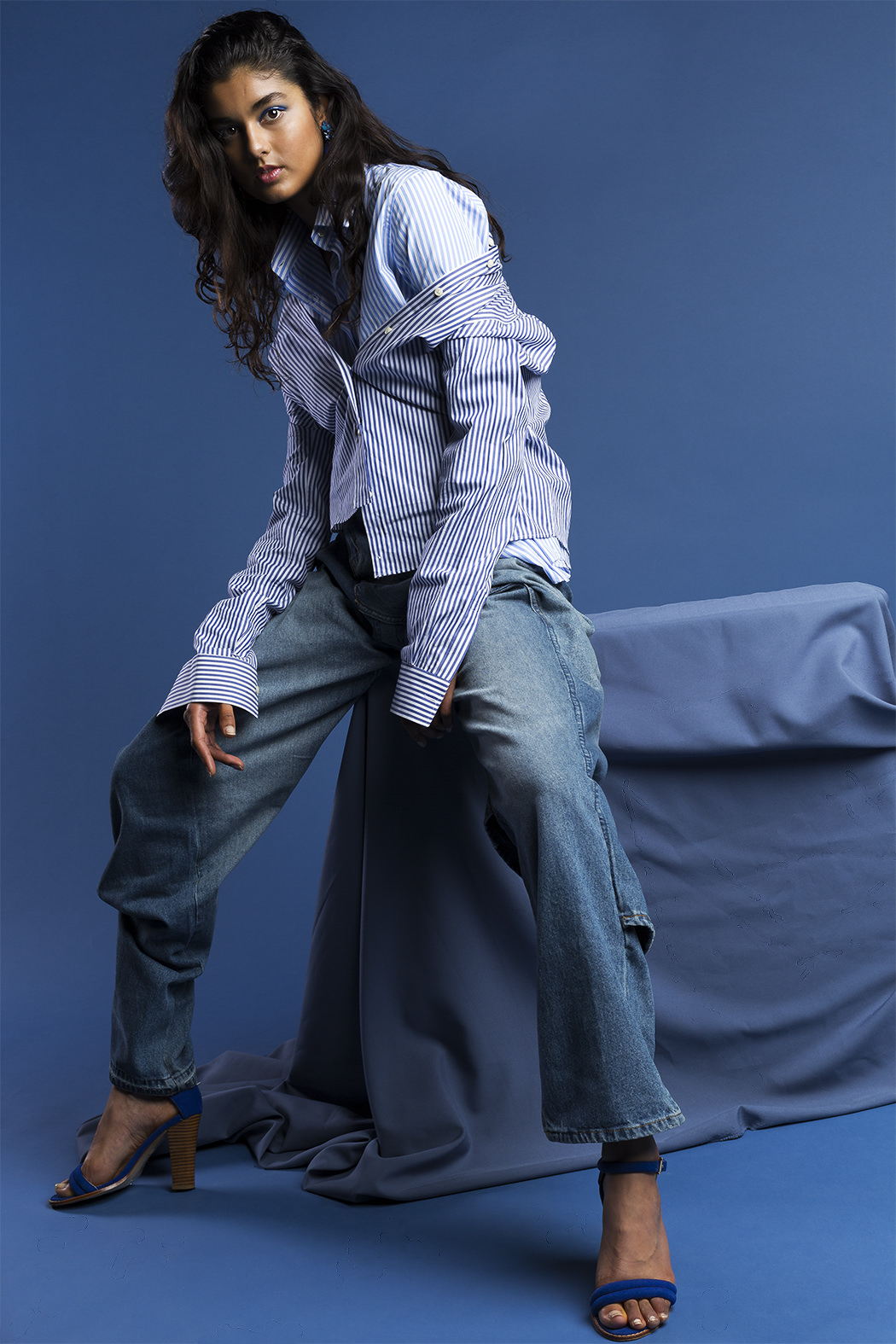 Shirts: Stella Jean Jeans: Paul Castro Earrings: Vickie Sarge Shoes: Models Own